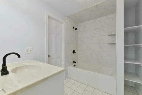a bathroom with a sink and a bathtub