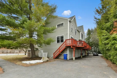 a view of house with a yard