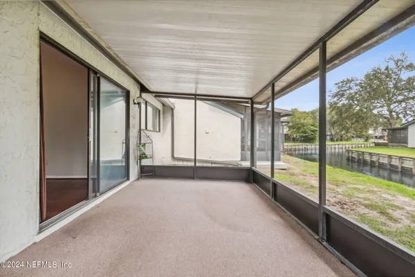 a view of an empty room with a large window