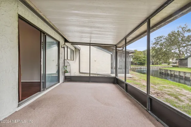 a view of an empty room with a large window