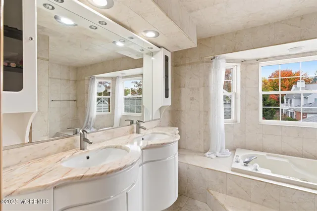 an aerial view of residential house with outdoor space and swimming pool