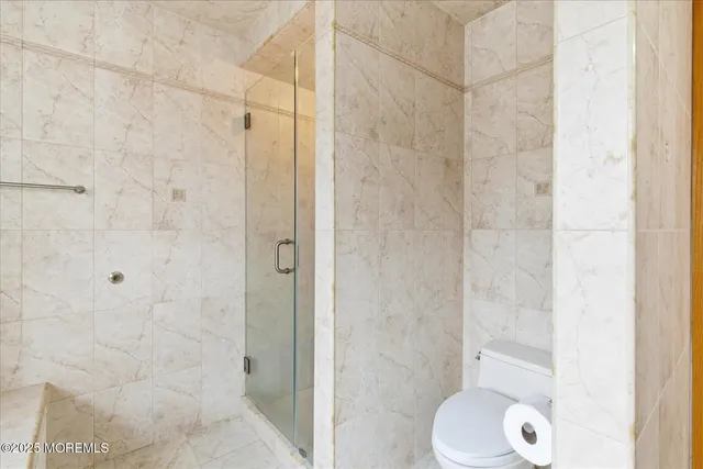 an aerial view of a house with garden space and street view