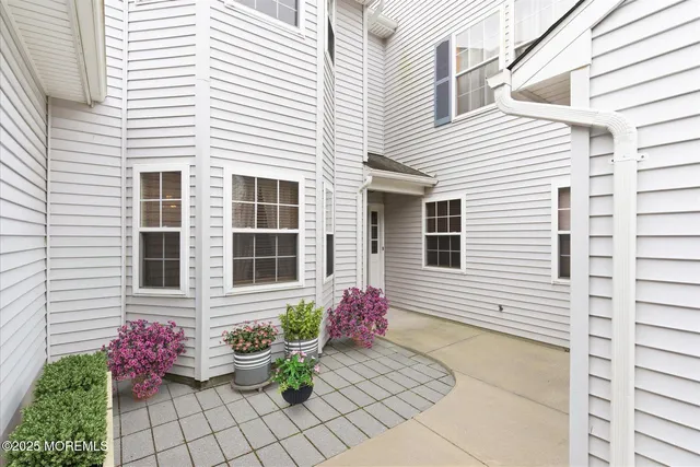 a pink flowers in front of a house