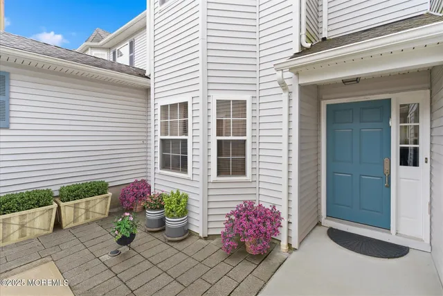 a pink flowers in front of a house