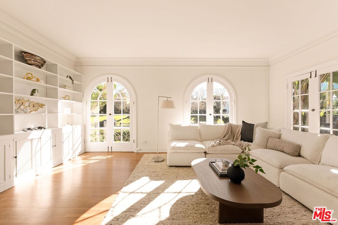441 South Muirfield Road Los Angeles, CA 90020 - Photo 11 of 33 a living room with furniture and a large window