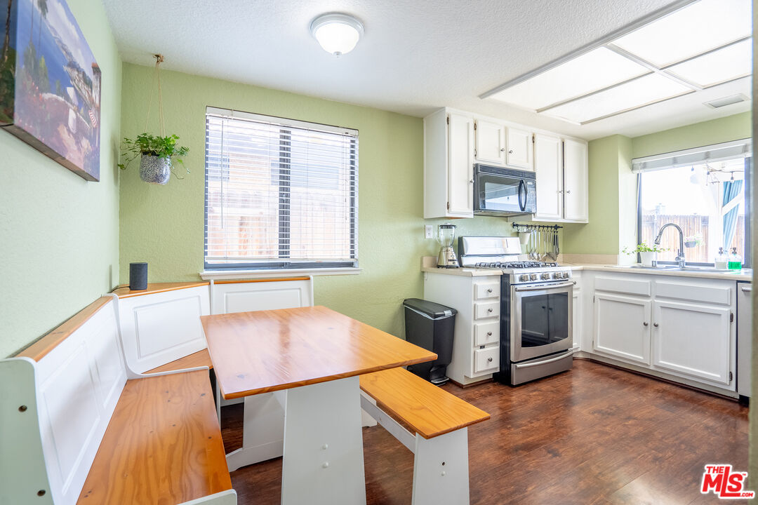 7489 Brookside Road Rancho Cucamonga, CA 91730 - Photo 13 of 41 a kitchen with a stove a sink and a refrigerator