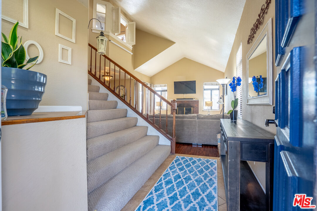 7489 Brookside Road Rancho Cucamonga, CA 91730 - Photo 3 of 41 a view of entryway and hall with wooden floor