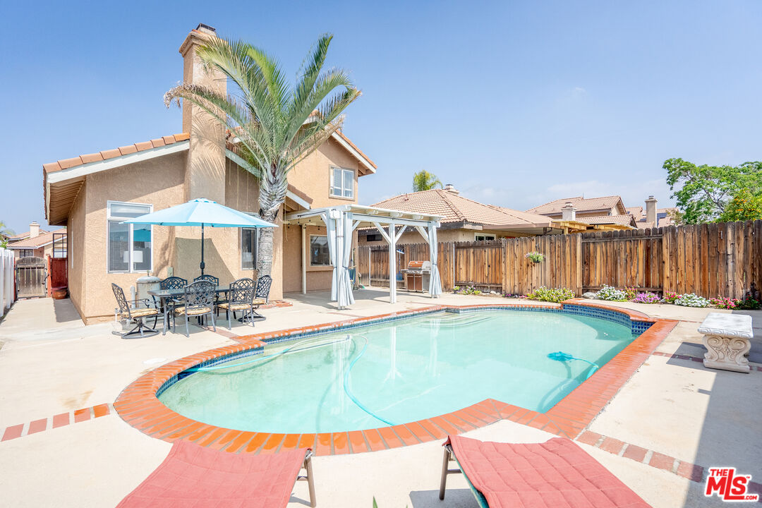 7489 Brookside Road Rancho Cucamonga, CA 91730 - Photo 34 of 41 a view of a house with swimming pool and sitting area