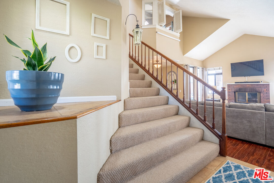 7489 Brookside Road Rancho Cucamonga, CA 91730 - Photo 4 of 41 a view of entryway and hall with wooden floor