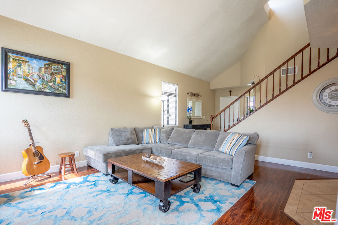 7489 Brookside Road Rancho Cucamonga, CA 91730 - Photo 9 of 41 a living room with furniture a rug and a potted plant
