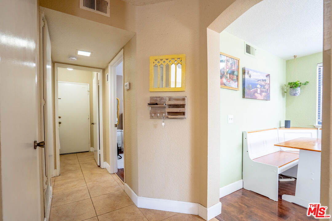 7489 Brookside Road Rancho Cucamonga, CA 91730 - Photo 10 of 41 a view of a hallway to a livingroom with furniture and windows