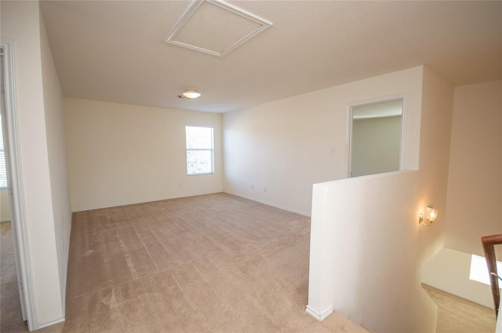 310 Falling Pine Drive Conroe, TX 77304 - Photo 8 of 15 a view of an empty room and window