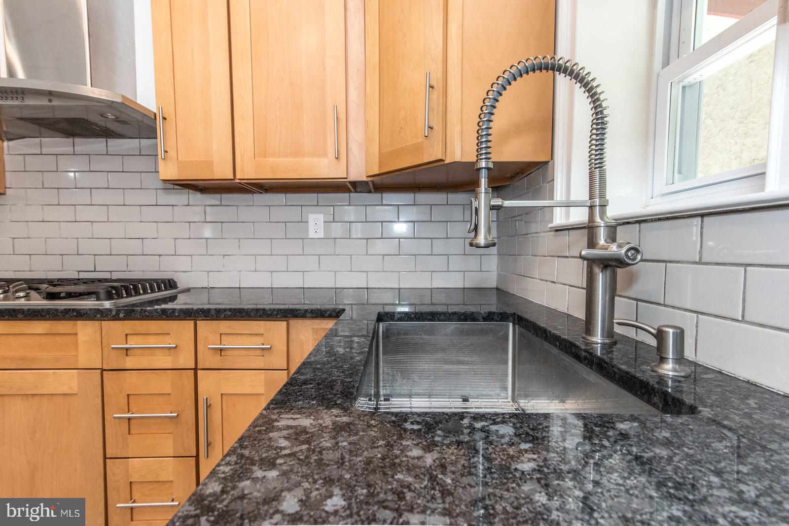 3905 Ridge Avenue Philadelphia, PA 19132 - Photo 25 of 102 Granite counters with tile backsplash
