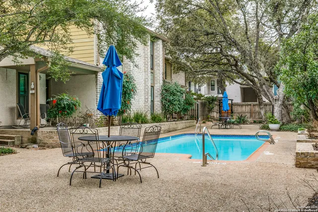 a house view with a sitting space and garden