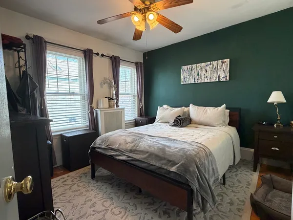 a bedroom with bed and window