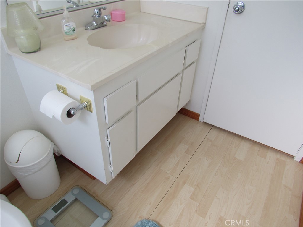26541 Chambers Avenue Menifee, CA 92586 - Photo 20 of 61 a bathroom with a sink and toilet
