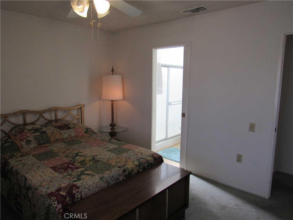 26541 Chambers Avenue Menifee, CA 92586 - Photo 23 of 61 a bedroom with a bed and a window