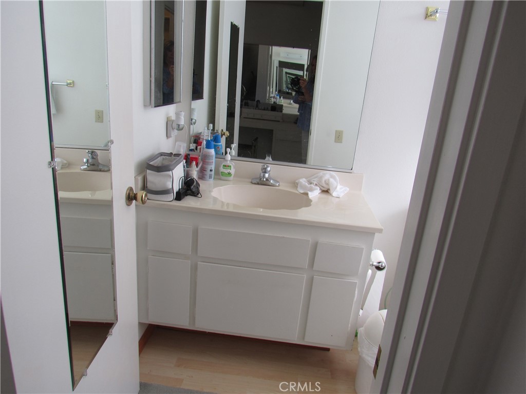 26541 Chambers Avenue Menifee, CA 92586 - Photo 29 of 61 a bathroom with a double vanity sink and a mirror