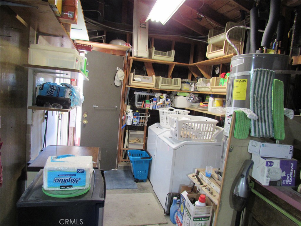 26541 Chambers Avenue Menifee, CA 92586 - Photo 51 of 61 a storage room with washer and dryer