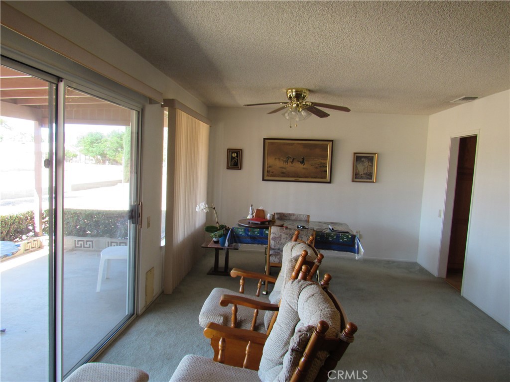 26541 Chambers Avenue Menifee, CA 92586 - Photo 8 of 61 a room with furniture and a window
