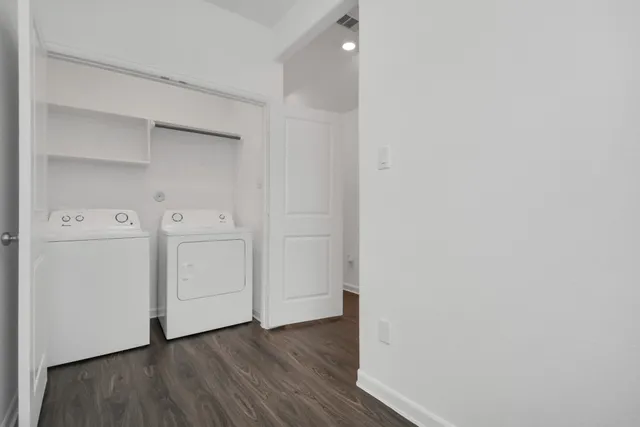 a view of storage and utility room with washer and dryer