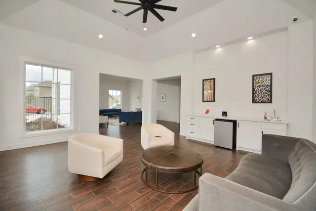 a living room with furniture and a large window