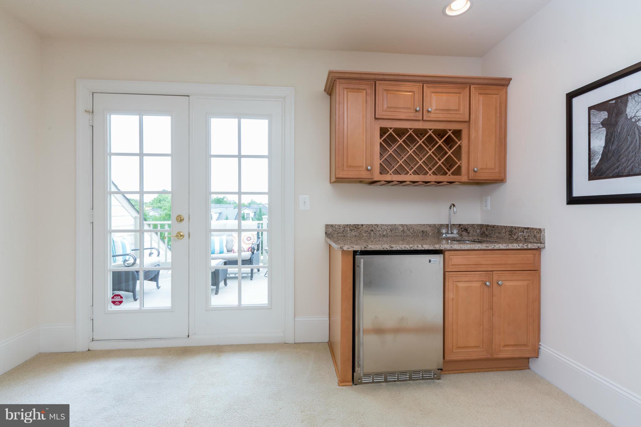 718 Carpenter Road Alexandria, VA 22314 - Photo 13 of 26 Wet bar conveniently located next to deck