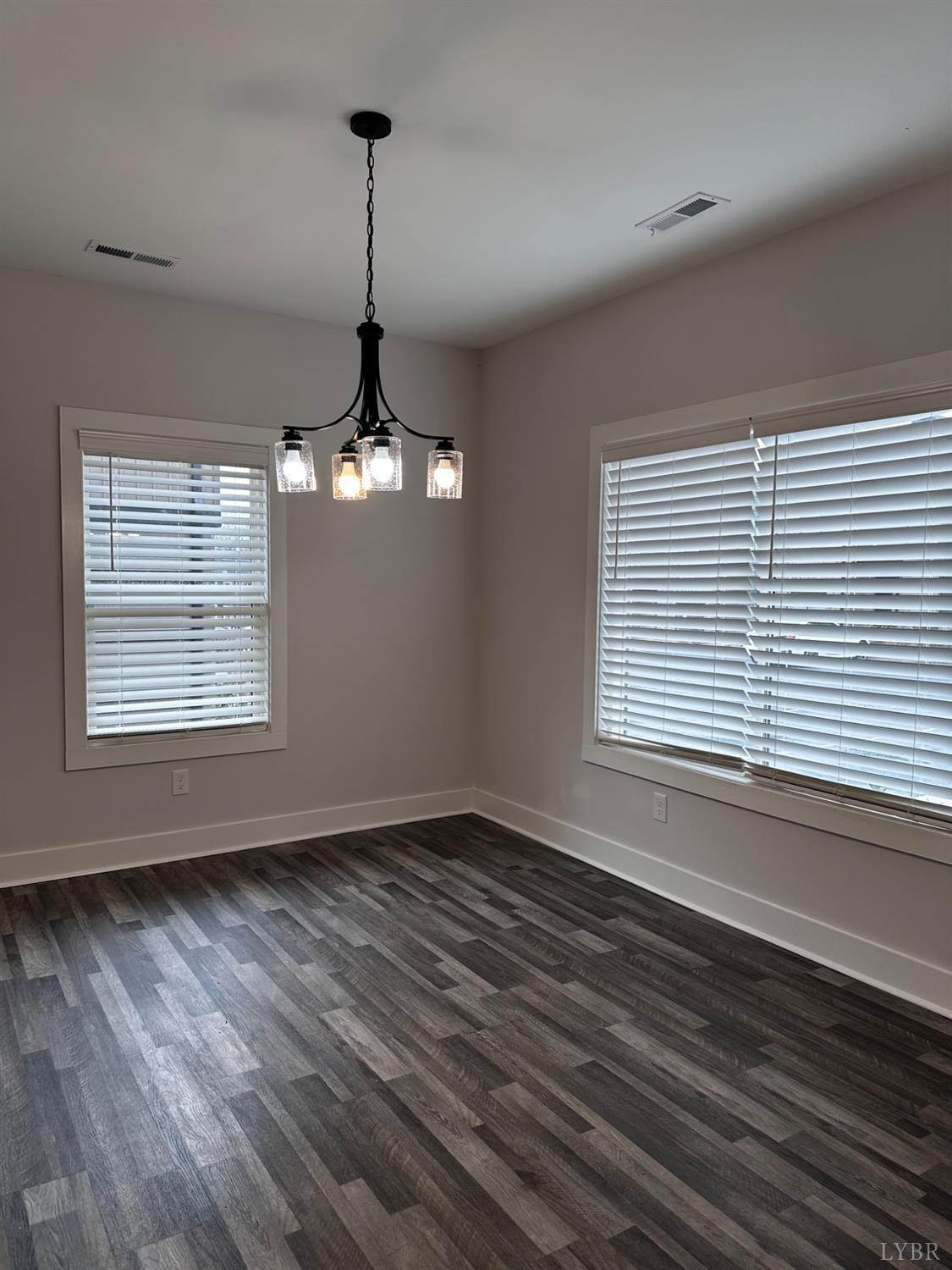 40 Allure Drive Rustburg, VA 24588 - Photo 8 of 20 a view of a room with wooden floor chandelier and windows