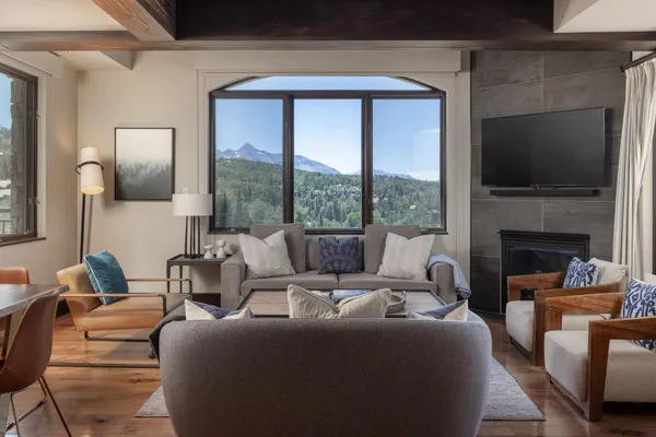 a living room with fireplace furniture and a flat screen tv