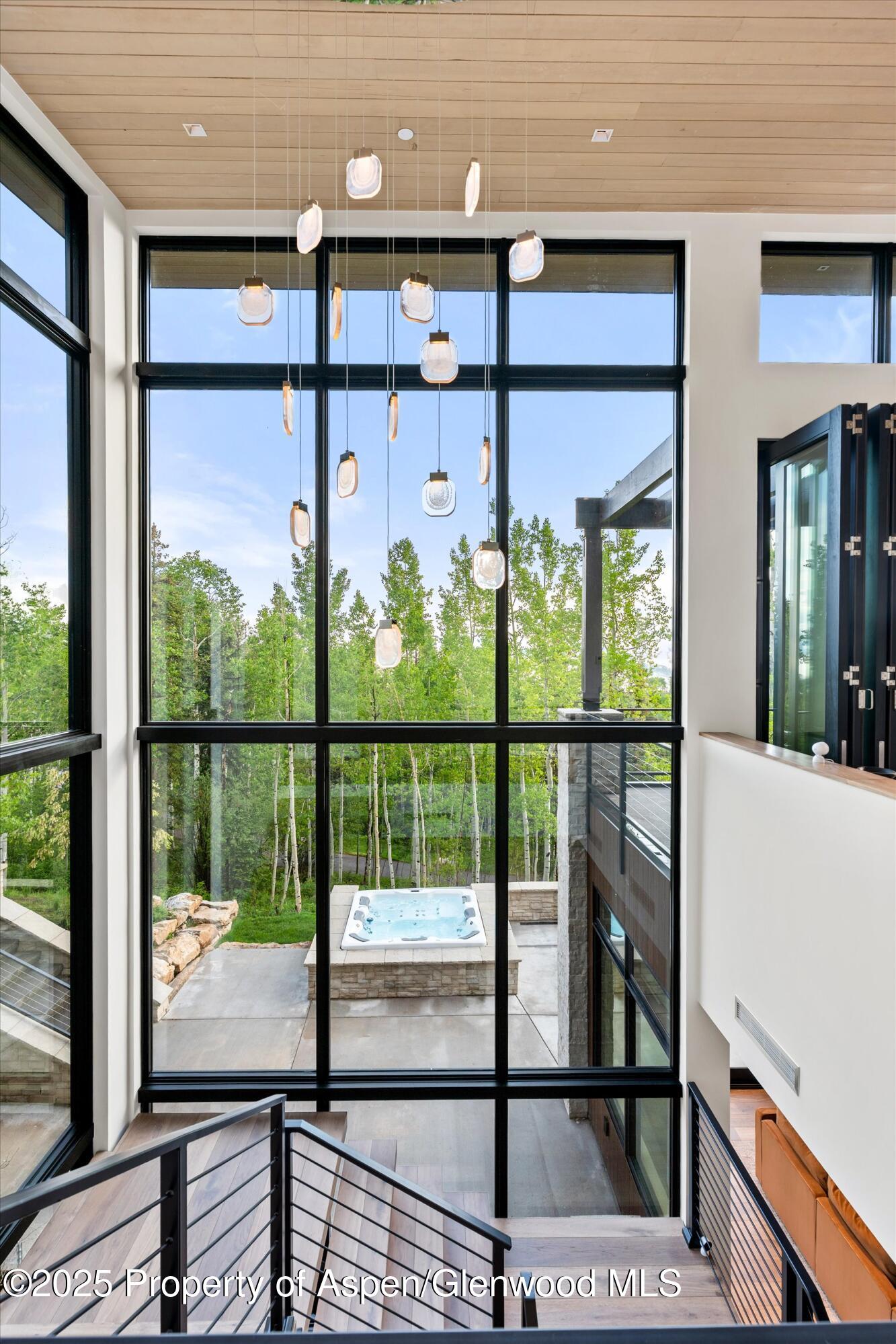 1234 Wood Road Snowmass Village, CO 81615 - Photo 26 of 66 a view of a glass door with a balcony