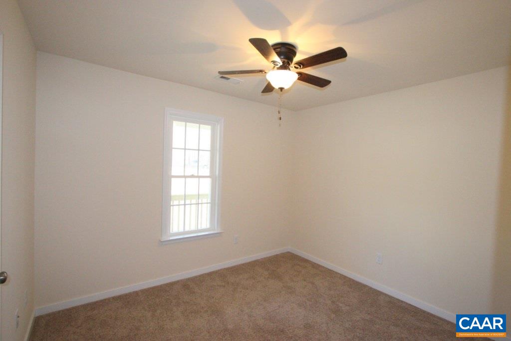12 Winding Ridge Way Bumpass, VA 23024 - Photo 13 of 18 an empty room with windows and fan