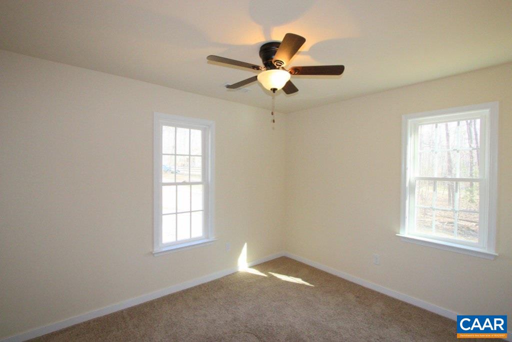 12 Winding Ridge Way Bumpass, VA 23024 - Photo 14 of 18 a view of a big room with windows and chandelier fan