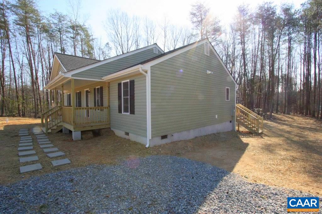 12 Winding Ridge Way Bumpass, VA 23024 - Photo 3 of 18 a view of a house with a yard and wooden fence