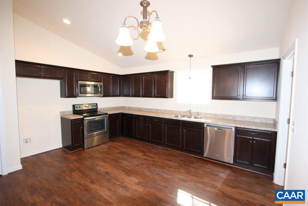 12 Winding Ridge Way Bumpass, VA 23024 - Photo 7 of 18 a kitchen with stainless steel appliances granite countertop a sink dishwasher a stove top oven a refrigerator with island and cabinets
