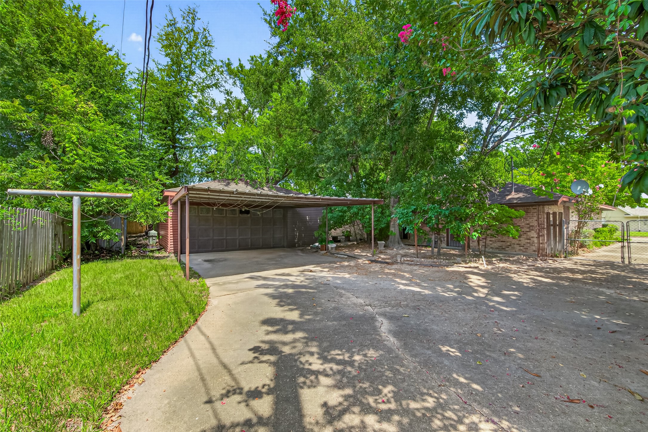 5311 Alba Road Houston, TX 77091 - Photo 26 of 27 Backyard has so much potential. Two car garage and a carport along with a covered porchh area.