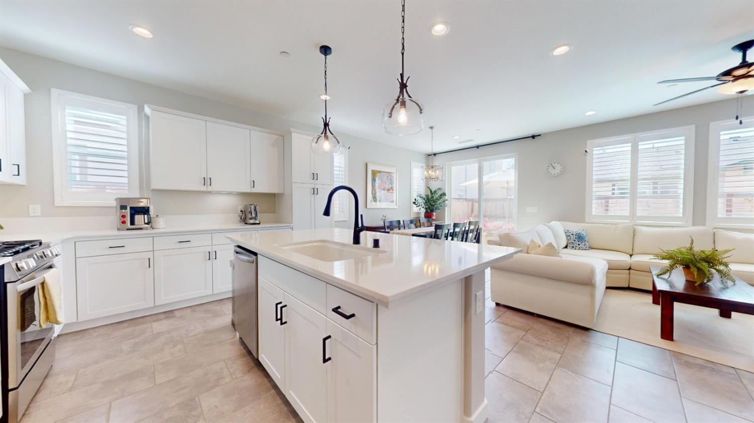 a kitchen with a sink stove and cabinets