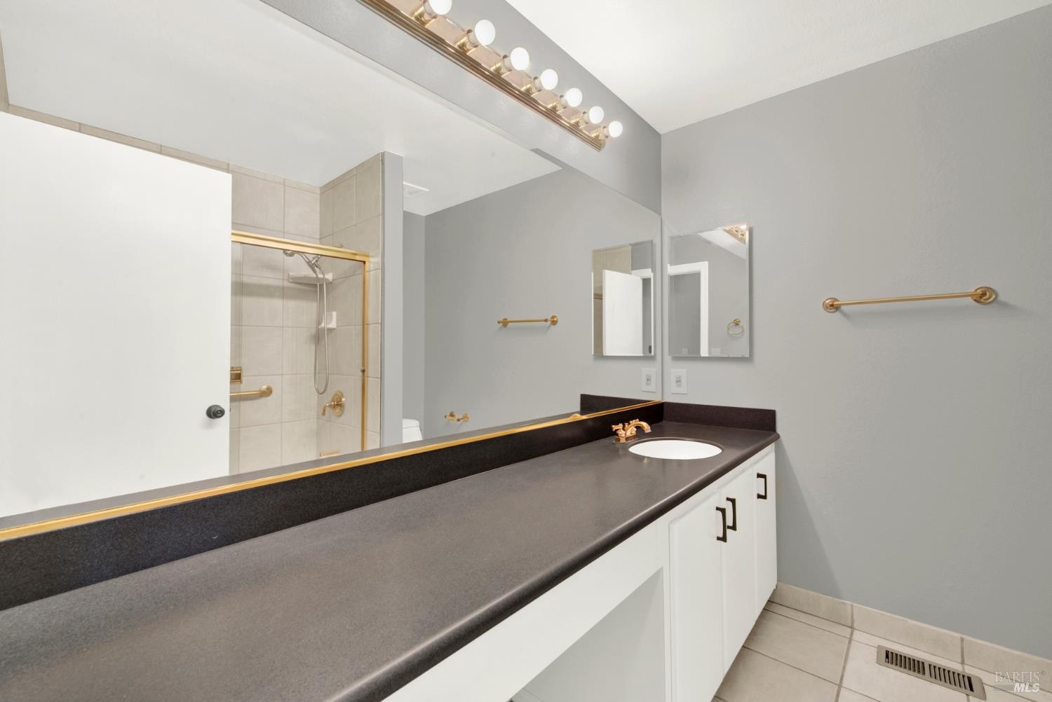 1270 Willow Lake Road Discovery Bay, CA 94505 - Photo 26 of 29 a bathroom with a sink and a mirror