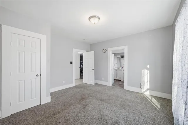 a view of empty room with an entrance