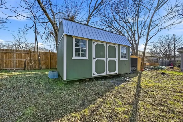 a house view with a backyard space