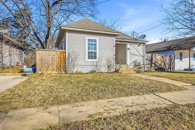 a view of a house with snow on the road