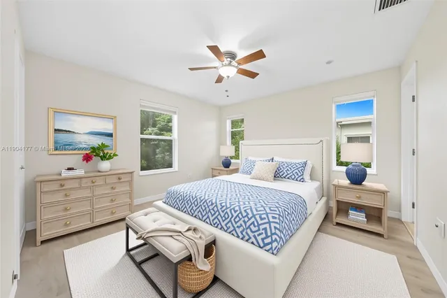 a bedroom with a bed and a dresser