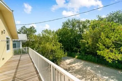a view of a house with a street