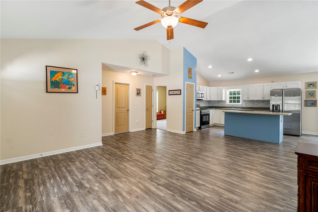 167 Mediterranean Avenue Anderson, SC 29621 - Photo 33 of 33 An open floor plan with high ceilings connects the living space and a well-appointed kitchen.