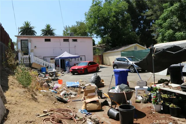a view of house with outdoor seating space