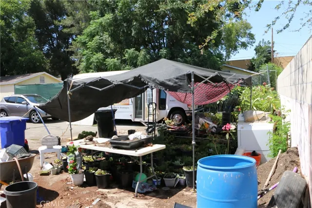 a front view of a house with sitting area