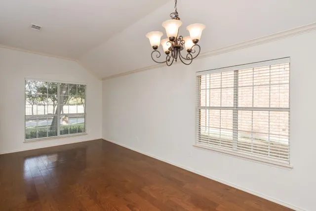 a view of a livingroom with a chandelier fan
