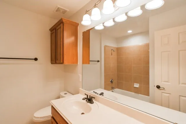 a view of a chandelier fan in a room