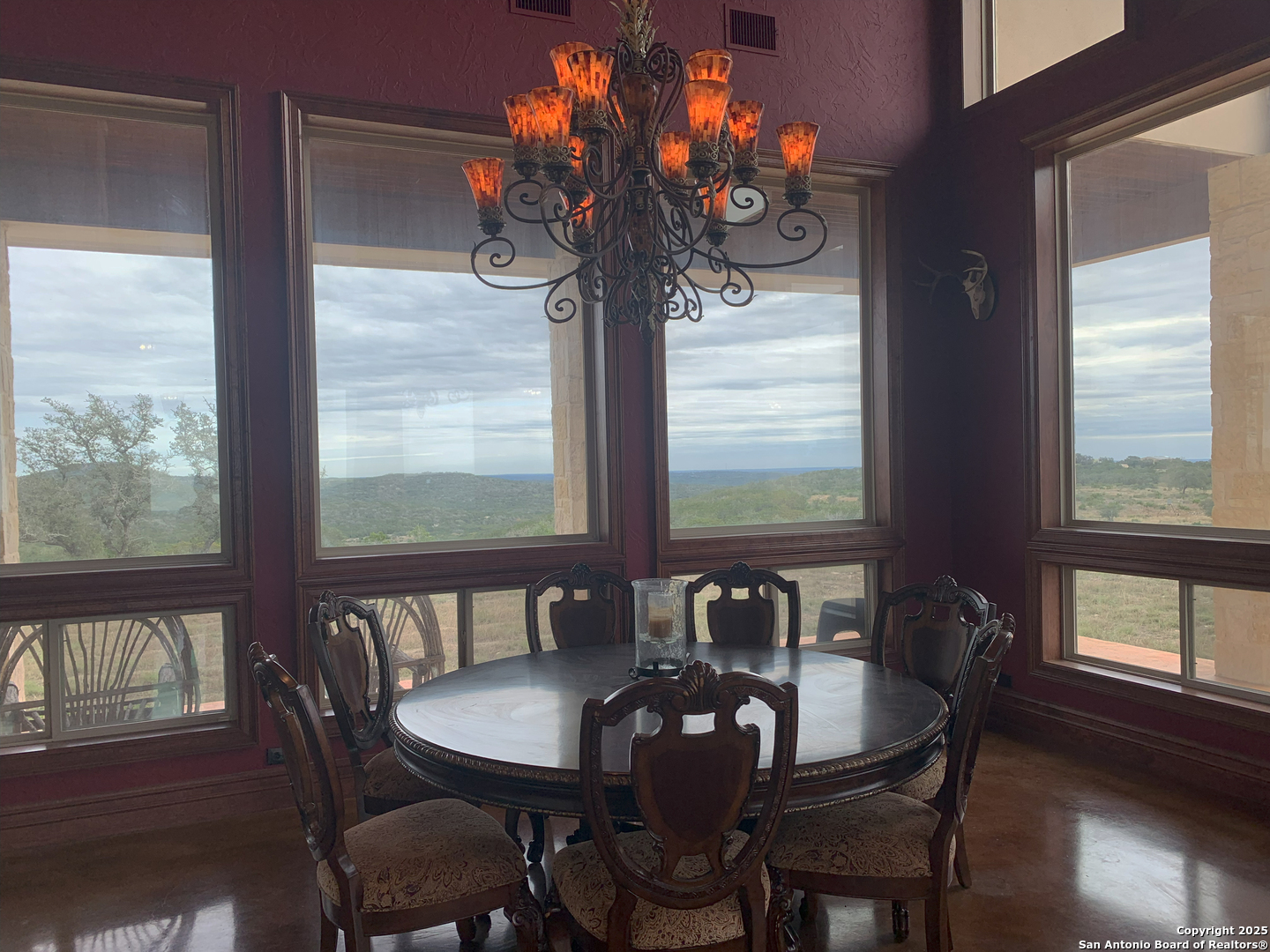 0 Pvt Road Hondo, TX 78861 - Photo 17 of 31 a view of a dining room with furniture wooden floor and chandelier