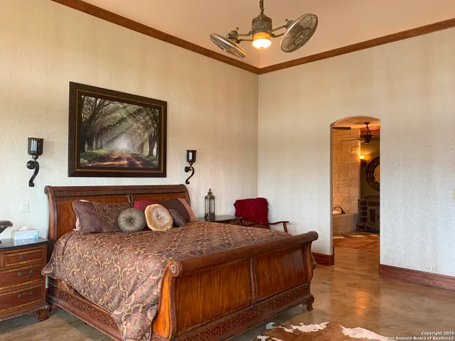 a bedroom with furniture and wooden floor