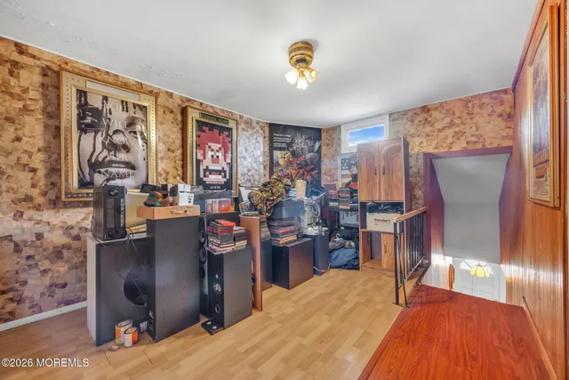 a bed room with a bed and a television